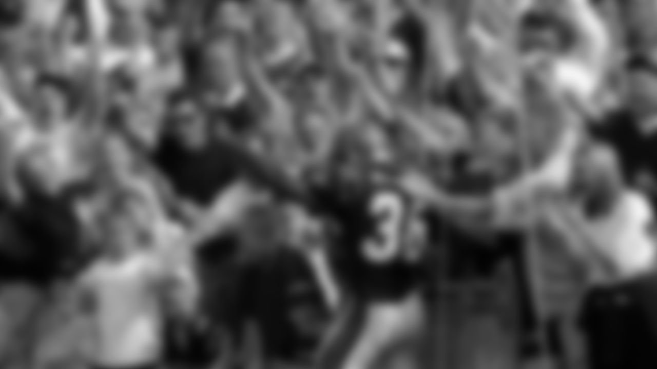 Cincinnati Bengals running back Brandon Bennett (36) celebrates in the stands after scoring on a 19-yard run in the third quarter, Sunday, Oct. 22, 2000, against the Denver Broncos. (AP Photo/David Kohl)