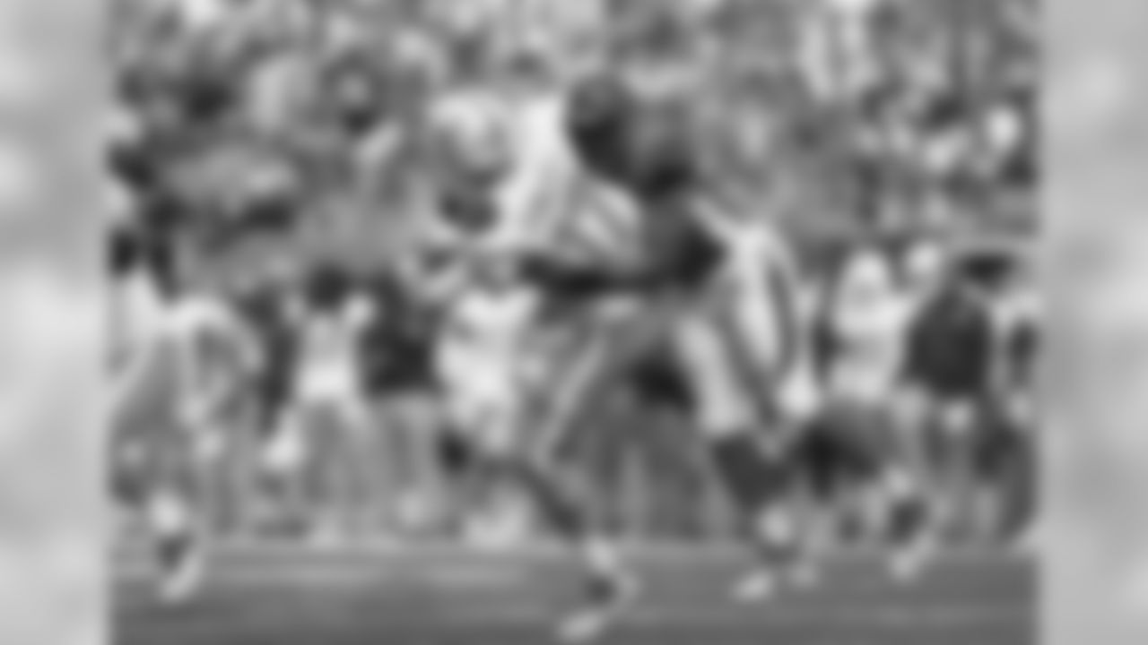 Bengals defensive end Jordan Willis (75) hits former Miami Dolphins quarterback Ryan Tannehill during the second half of Cincinnati's week five game.