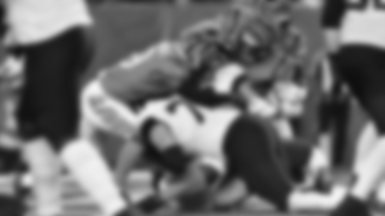Akeem Davis-Gaither, Logan Wilson and Larry Ogunjobi stop the Jaguars Trevor Lawrence at the goal line in the second quarter.