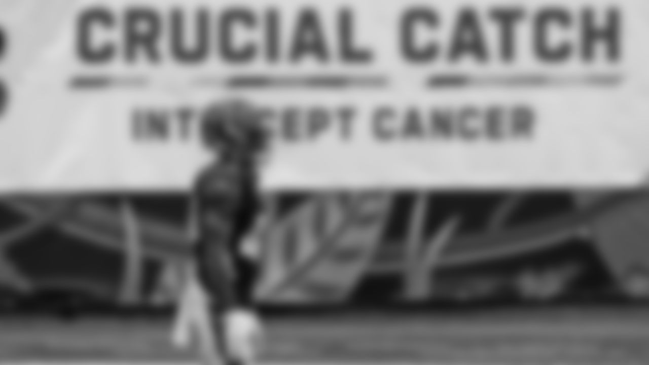 Cincinnati Bengals' Brandon Wilson warms up in front of a "Crucial Catch" banner before an NFL football game against the Cleveland Browns, Sunday, Oct. 25, 2020, in Cincinnati. (AP Photo/Michael Conroy)