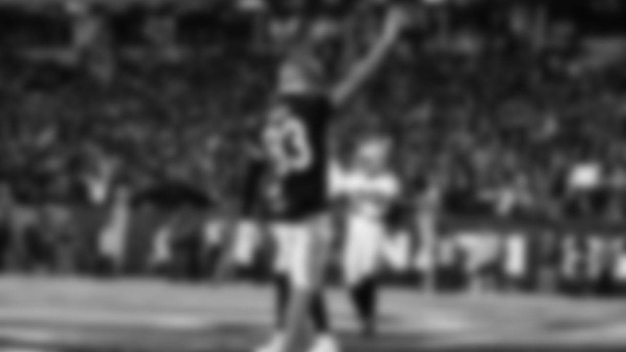 Tyler Boyd holds the ball up after catching a 10-yard touchdown pass from Joe Burrow in the second quarter of the AFC Wild Card game against the Las Vegas Raiders.