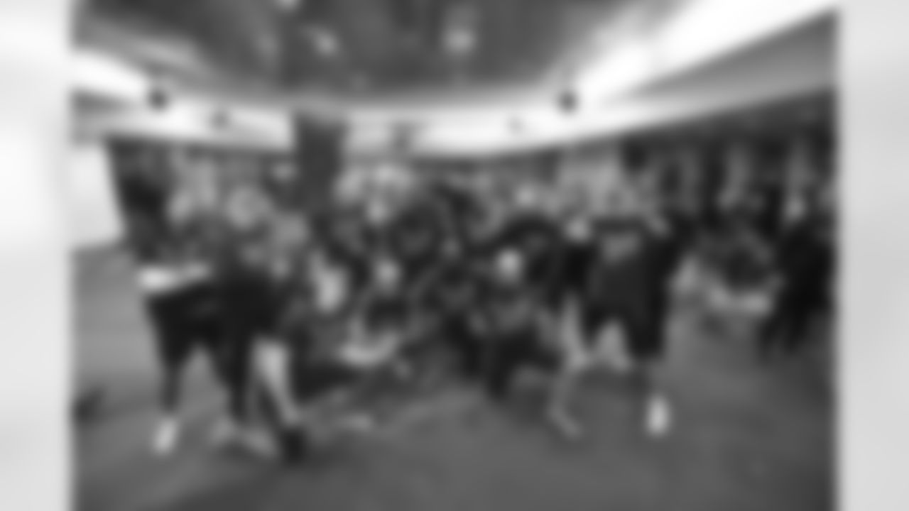 Bengals special teams pose for a photo as the team celebrates winning the AFC North in the Bengals locker room at Paycor Stadium on Sunday, January 8 2023.