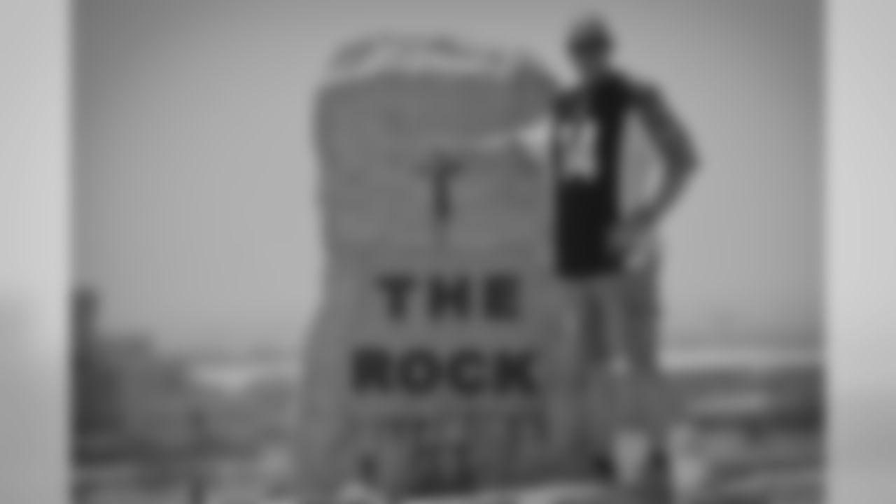 In anticipation of the upcoming NFL regular season kickoff, U.S. Air Force Senior Master Sgt. Robert Stamper, a Newport, Ky., native deployed to the 386th Air Expeditionary Wing in Southwest Asia, poses for a photo at the 386th AEW's "Rock" monument proudly wearing his Cincinnati Bengals jersey.