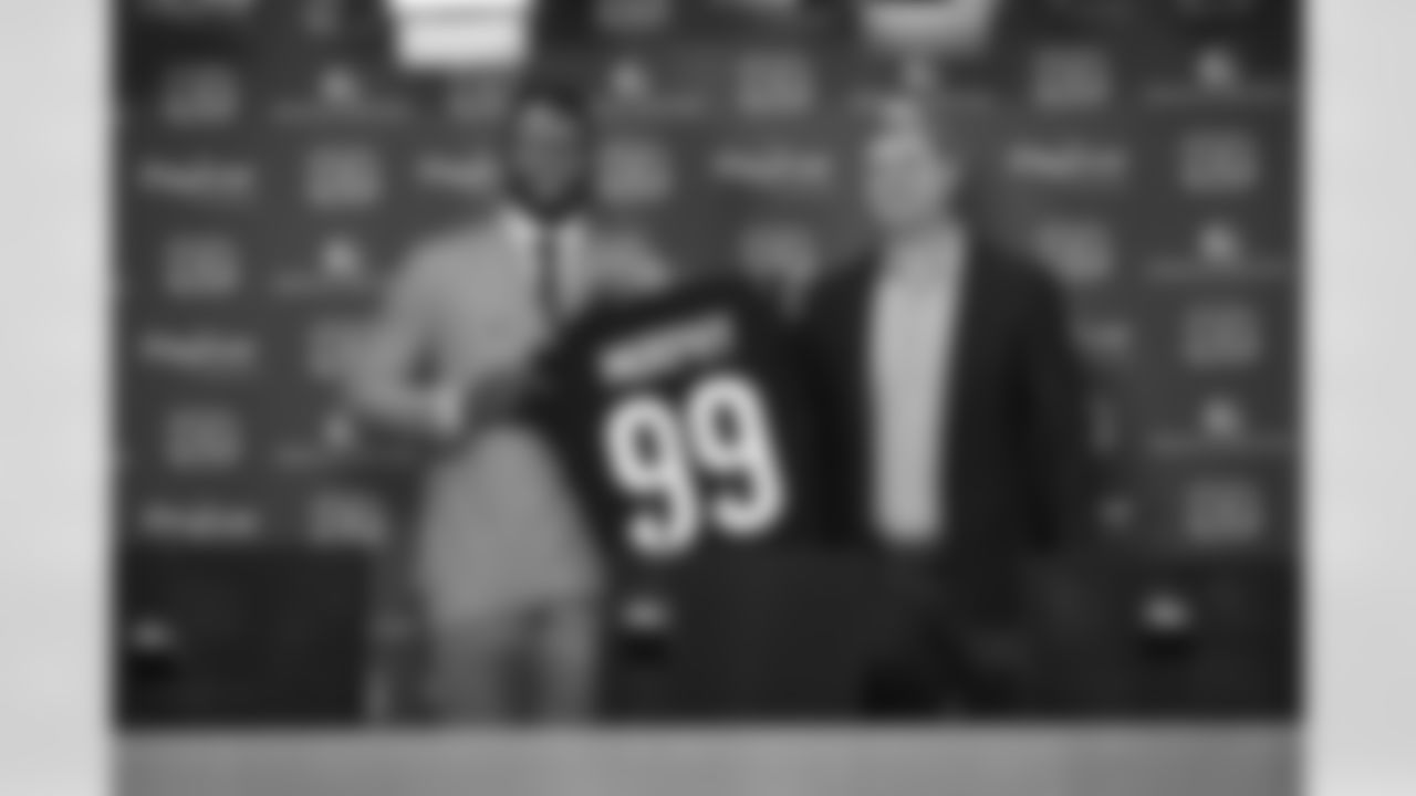DE Myles Murphy (left) poses with his Bengals jersey with head coach Zac Taylor during Murphy's first visit as a Bengal to Paycor Stadium on Saturday, April 29 2023.