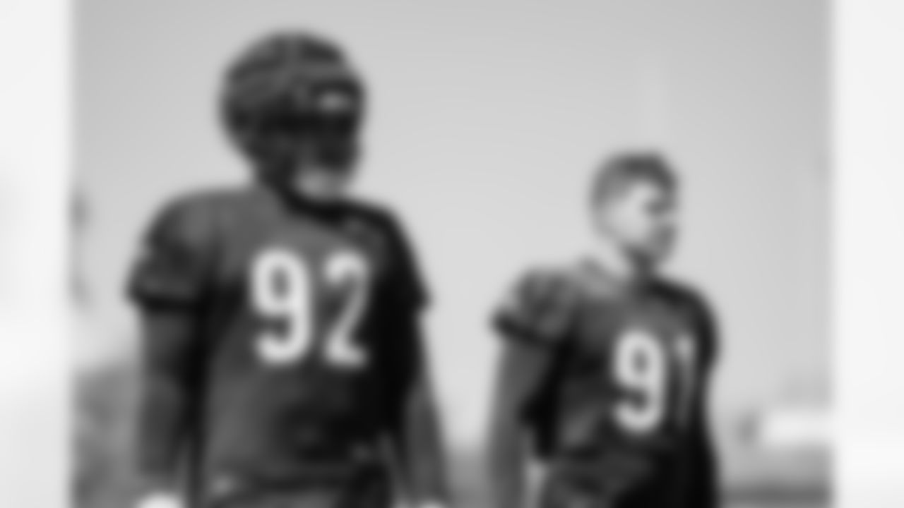 DT B.J. Hill (left) and DE Trey Hendrickson stand during practice at the Kettering Health Practice Fields on Thursday, August 31, 2023.