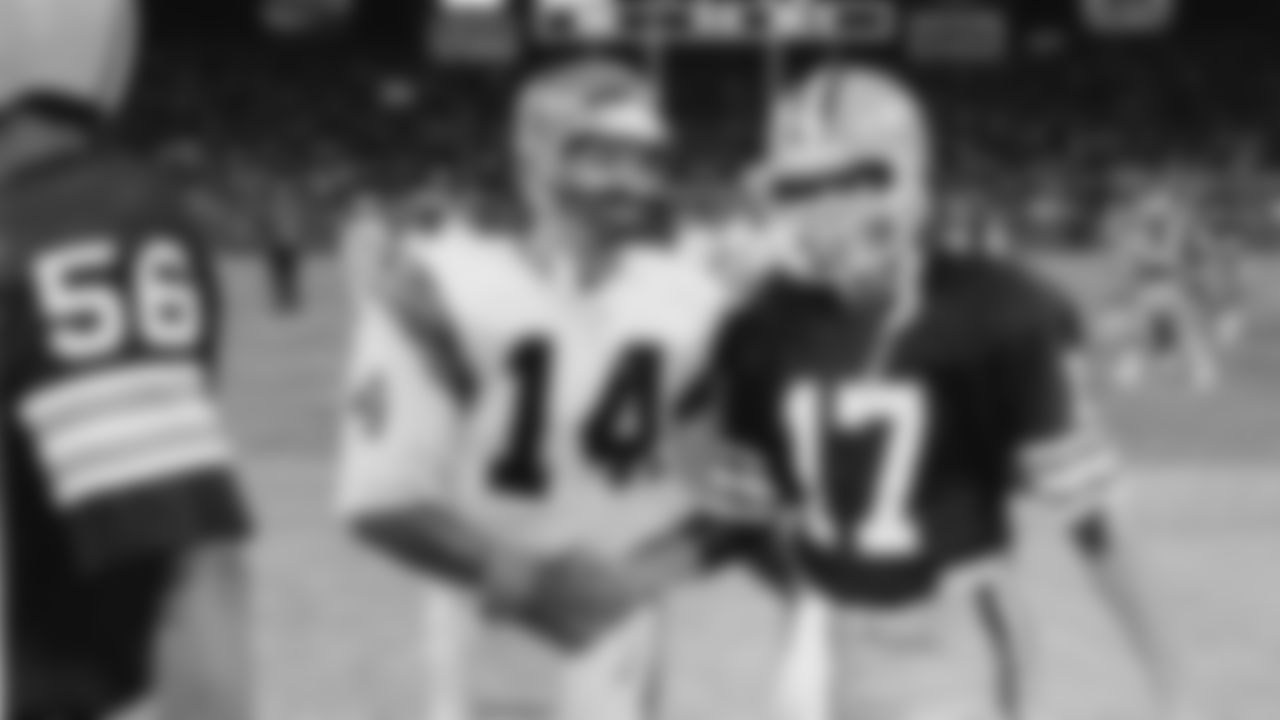 Cincinnati Bengals quarterback Ken Anderson (14) smiles as he congratulates Cleveland Browns' quarterback Brian Sipe (17) on his teams 17-7 victory over the Bengals in a game played in Cleveland on Sept. 15, 1983. (AP Photo)