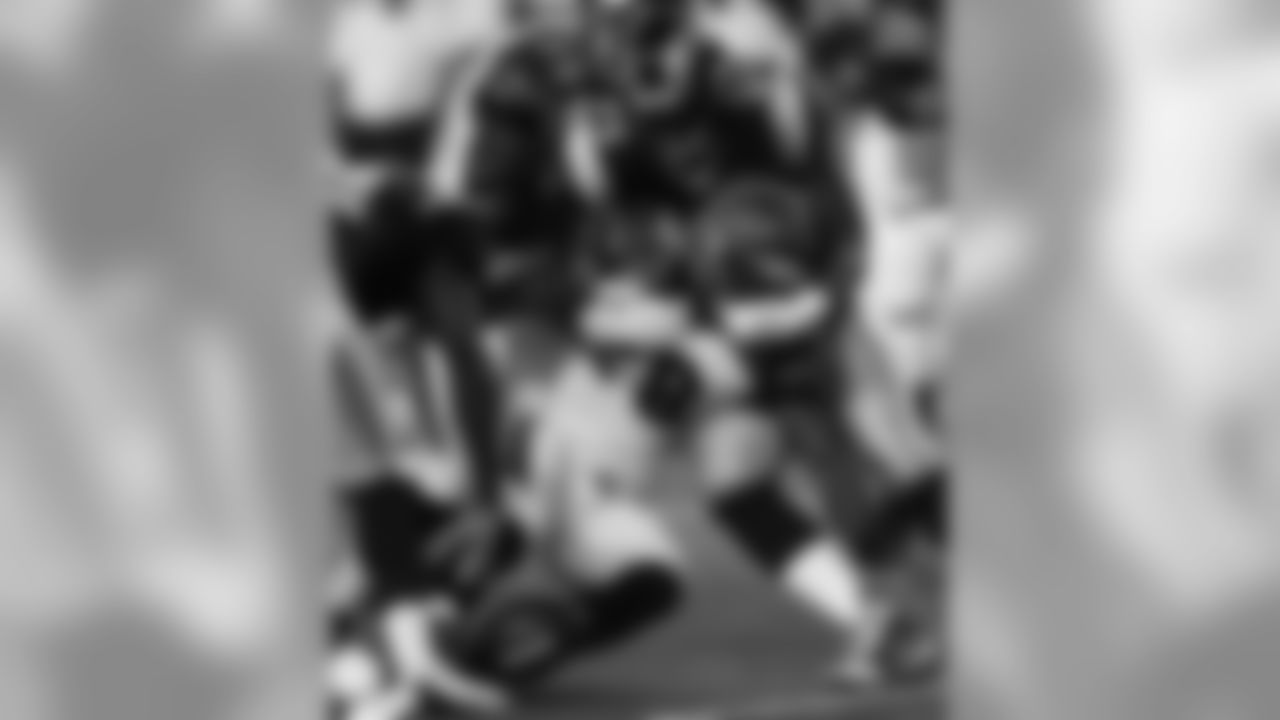 Cincinnati Bengals running back Bernard Scott (28) fumbles the ball as he is tackled by St. Louis Rams defensive end Victor Adeyanju (94) in the first half of a preseason NFL football game, Thursday, Aug. 27, 2009, in Cincinnati. (AP Photo/David Kohl)