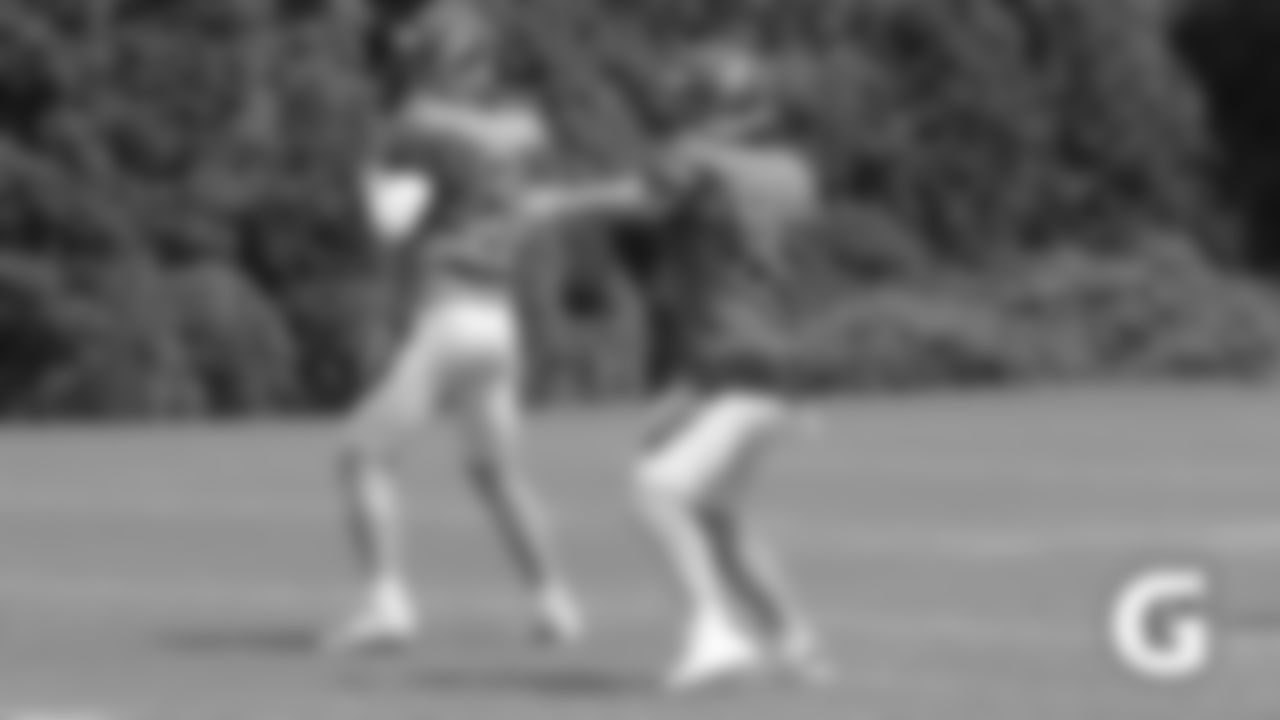 Bengals quarterbacks Jeff Driskel (left) and Andy Dalton (right) throw during training camp.