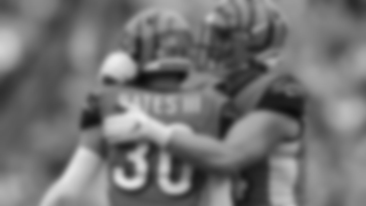 Cincinnati Bengals free safety Jessie Bates (30) celebrates with defensive end Sam Hubbard (94) during an NFL football game against the Arizona Cardinals, Sunday, Oct. 06, 2019, in Cincinnati. (Aaron Doster via AP)