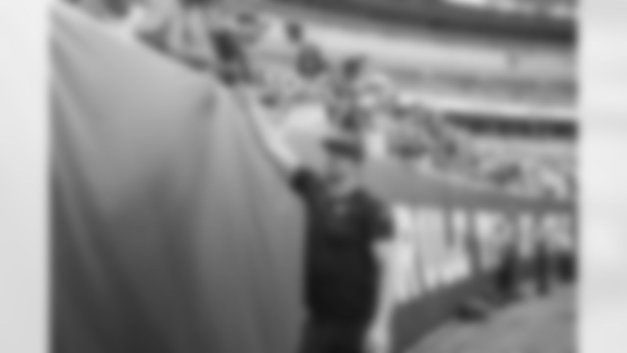 DE Sam Hubbard high-fives fans at Paycor Stadium during the Packers-Bengals preseason game on Friday, August 11, 2023.