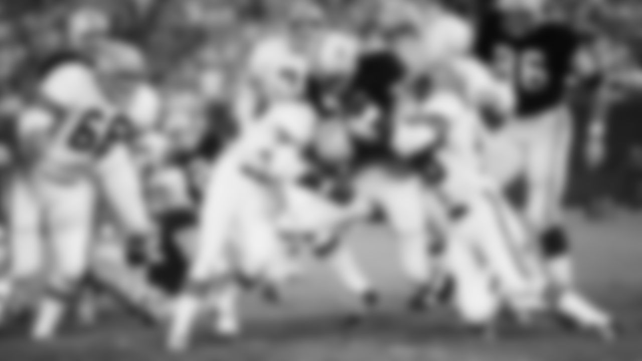 Bengals cornerbacks Lemar Parrish (left) and Ken Riley (right) make a tackle on Sunday, Oct 3, 1971 at Lambeau Field.