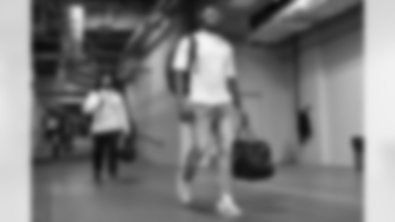 DE Joseph Ossai walks to the visitors locker room at Nissan Stadium before Week 12 against the Tennessee Titans in Nashville, Tennessee.