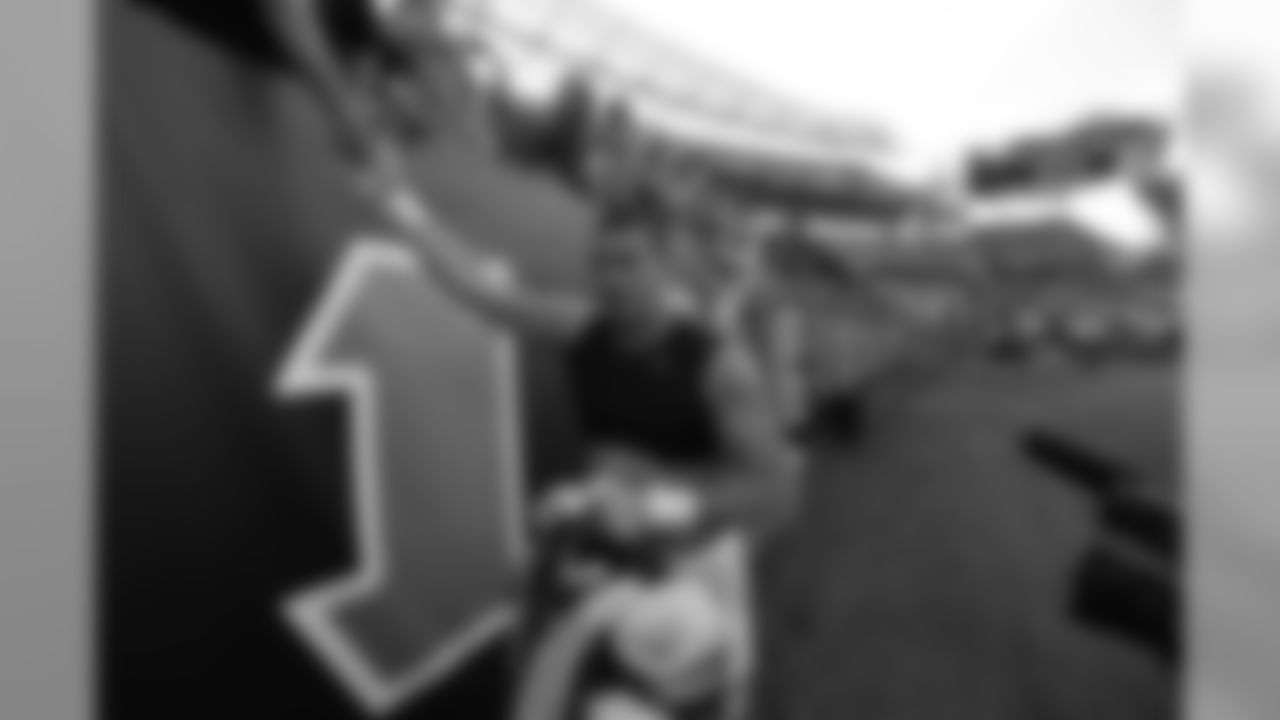 Defensive end Sam Hubbard high fives fans after the Bengals defeated the Miami Dolphins in week 5.