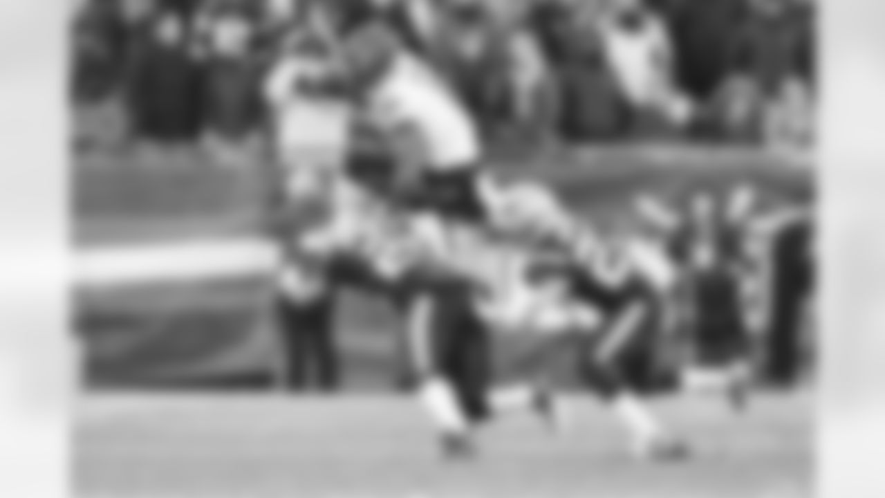 WR Ja'Marr Chase hurdles over Patriots defense in the fourth quarter of the Bengals-Patriots game on Saturday, December 24 2022 at Gillette Stadium in Foxborough, Massachusetts.