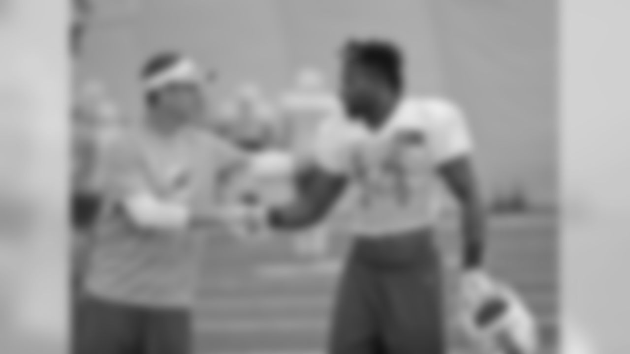 Miami Dolphins Defensive Backs coach Lou Anarumo, left, chats with wide receiver Jarvis Landry (14) at the teams NFL football training camp, Tuesday, Aug. 4, 2015 in Davie, Fla. (AP Photo/Wilfredo Lee)