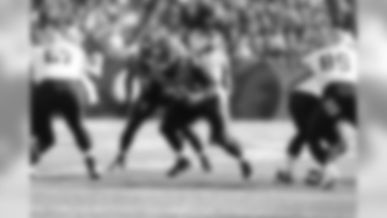 Defensive tackle Josh Tupou breaks out of his stance during a play against the New Orleans Saints.