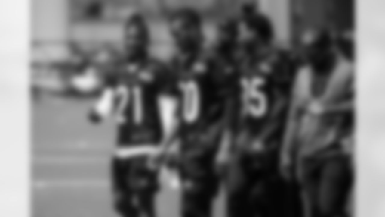 Members of the Bengals secondary walk and talk with each other during Phase 2 training at Kettering Practice Fields on Wednesday, May 17 2023 in Cincinnati, Ohio