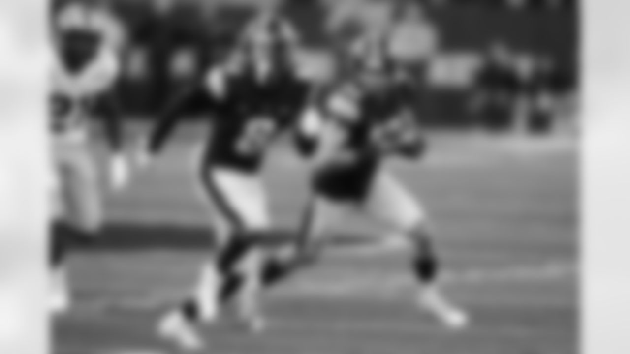 Iowa wide receiver Charlie Jones (16) returns a punt with teammate Matt Hankins (8) during the second half of an NCAA college football game against Purdue, Saturday, Oct. 16, 2021, in Iowa City, Iowa. Purdue won 24-7. (AP Photo/Charlie Neibergall)