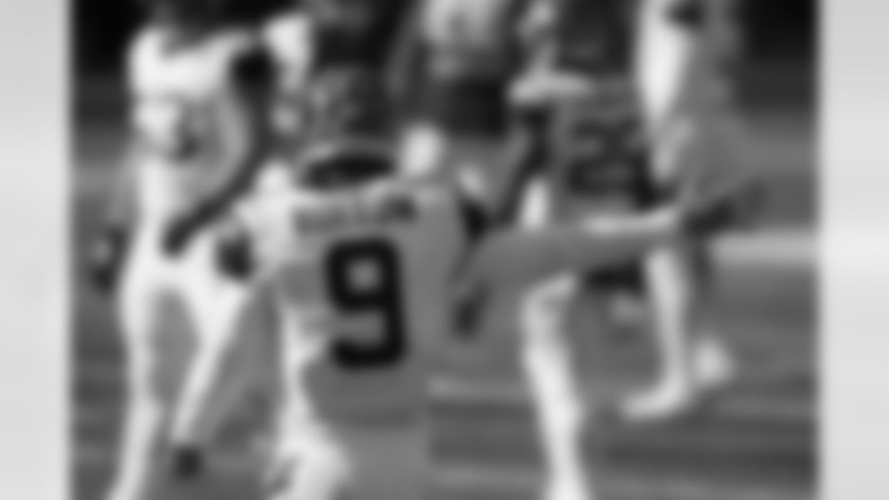 Cincinnati Bengals quarterback Joe Burrow (9) motions a first down during the first half of an NFL football game against the Tennessee Titans, Sunday, Nov. 1, 2020, in Cincinnati. (AP Photo/Bryan Woolston)