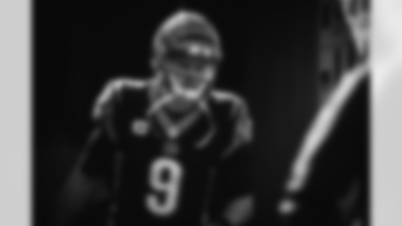 Joe Burrow comes over to celebrate RB Joe Mixon's touchdown against the Jacksonville Jaguars in week four of the season.