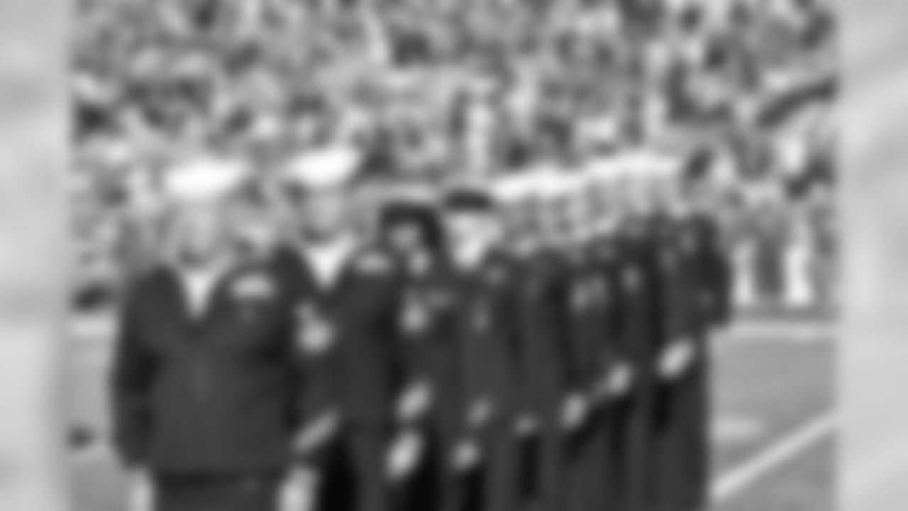 Members of the United States military standing on the field at Ralph Wilson Stadium to be honored on Salute to Service gameday 2015.