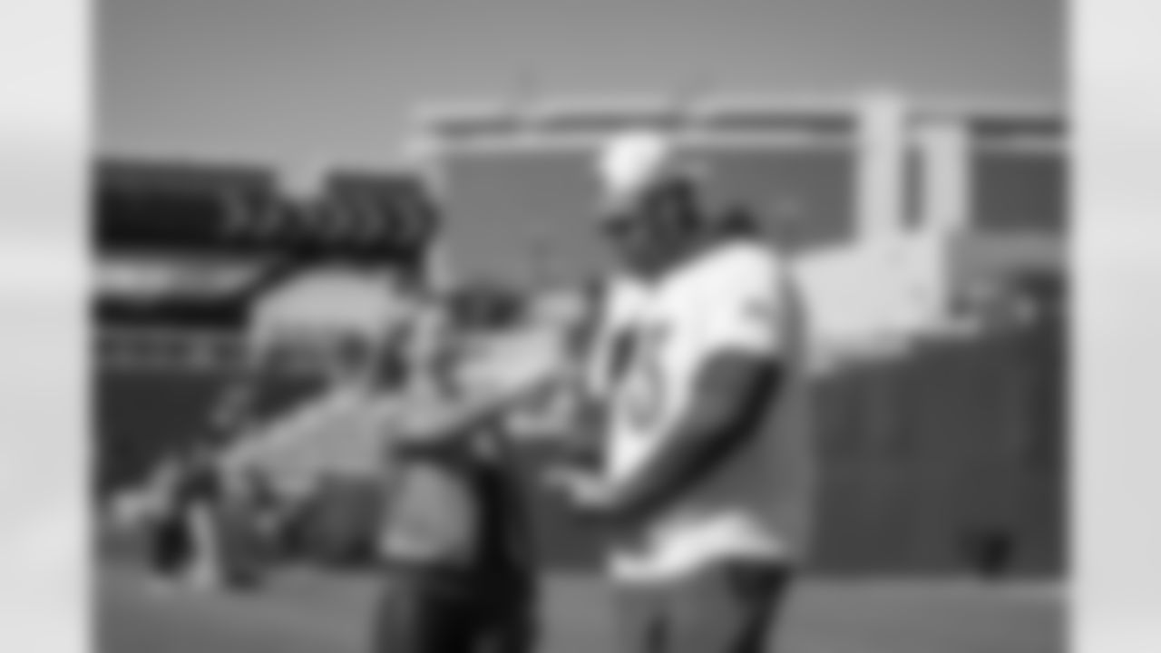 Maddy Glab and Dion Dawkins (73) during the AFC Pro Bowl practice on Feb 3, 2022 at the Las Vegas Ball Park in Las Vegas, Nevada. Photo by Ben Green