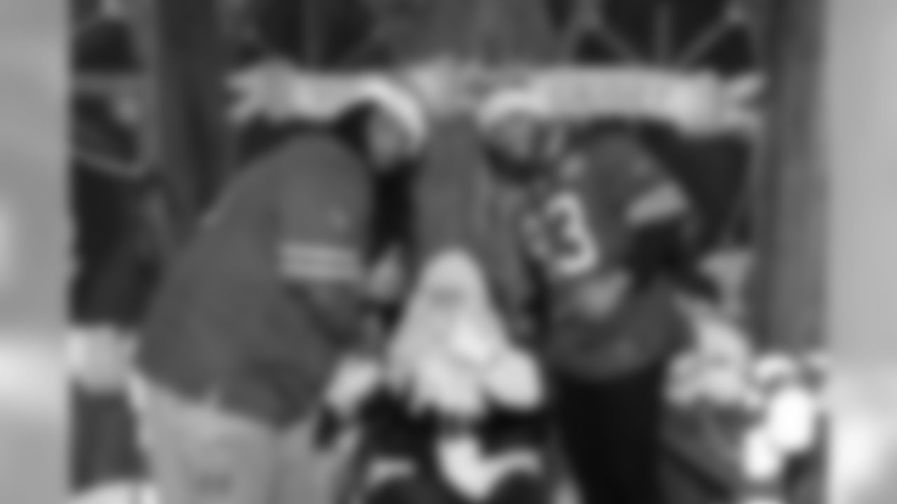Cyril Richardson and Bryan Johnson at the annual Bills kids holiday party
