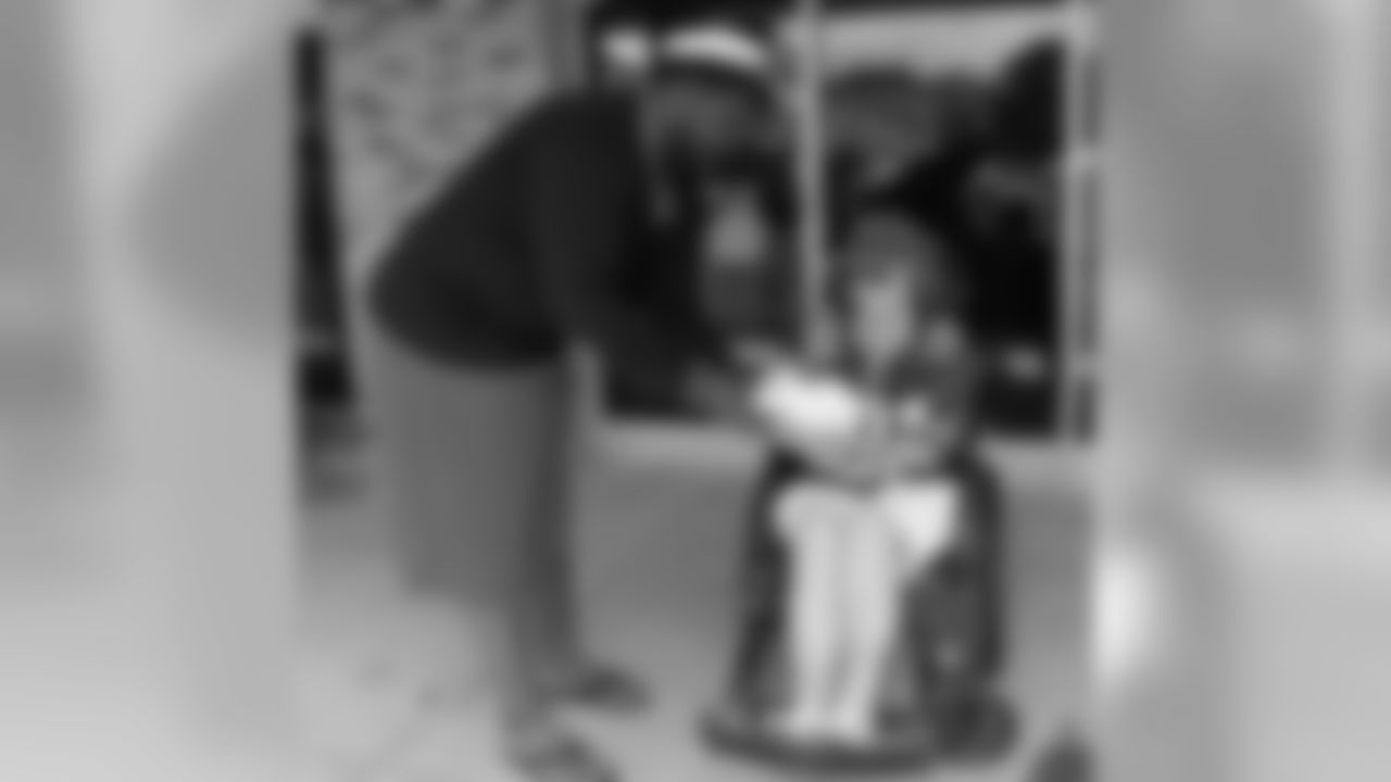 Marcell Dareus asks to sign Mary Rose's football.