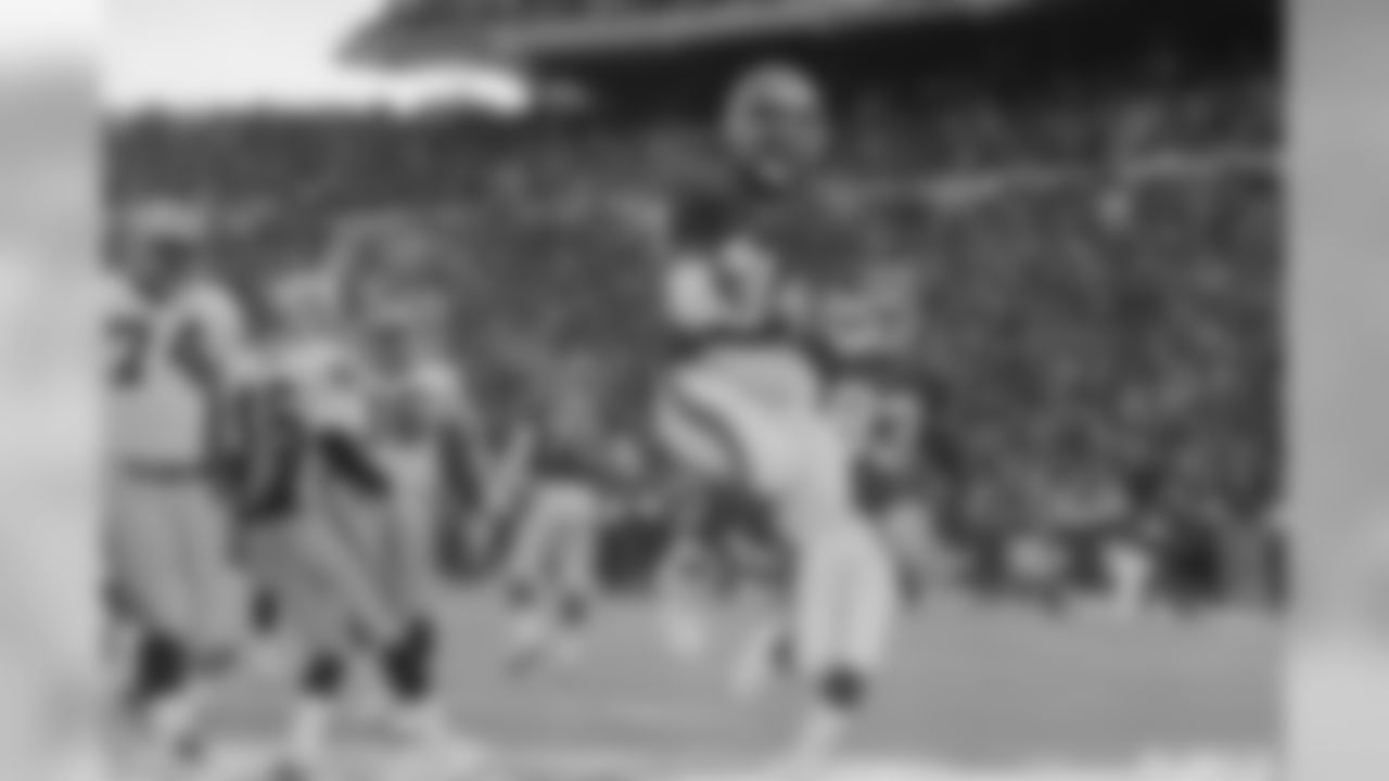 1988 | Thurman Thomas, RB | Oklahoma State
Thomas was selected #40 overall, and went on to have one of the best careers by a running back in NFL history. He is the Bills record holder in a number of categories, including rushing touchdowns and yards. He is a member of the Pro Football Hall of Fame and had his number 34 retired by the Bills in 2018.
Buffalo Bills back Thurman Thomas (34) jumps in the air as he celebrates his second quarter touchdown against Los Angeles Raiders, Sunday, Jan 15 ,1994 in Orchard Park, NY . The Bills beat defeated the Raiders 29-23. (AP Photo/Bill Sikes)