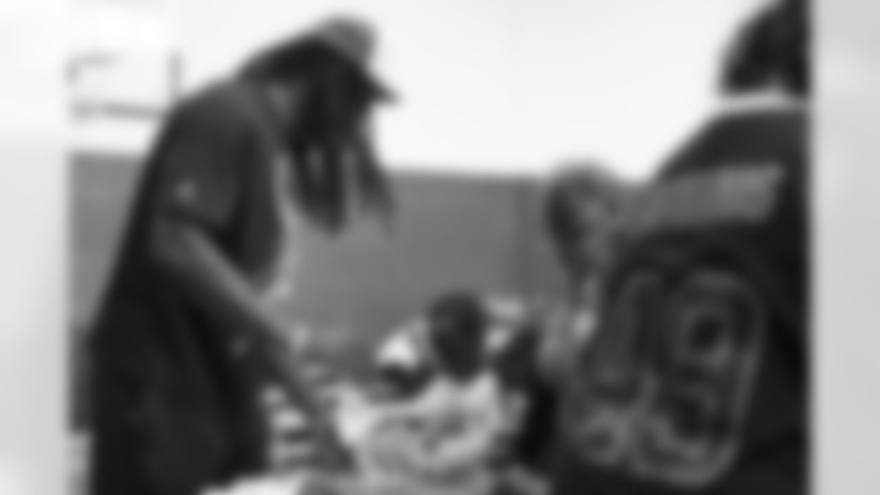 Tremaine Edmunds hands out shoes and school supplies at the Boys and Girls Club of Buffalo, Masten Club House, on August 15, 2022. Photo by Ben Green