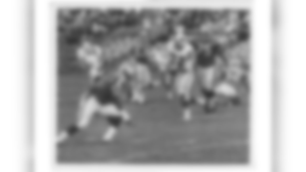 1965 - 1972 | Blue stripes are added to the red stripe on the helmet. The Buffalo Bills won the 1965 AFL Championship in these uniforms, and wore them as the team transitioned to the NFL in 1970.
DE Ron McDole (72) is pictured here. He played eight seasons in Buffalo, and is a member of the AFL Hall of Fame.