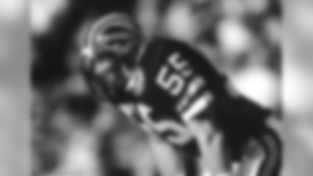 1984 | Red helmets are introduced for the first time. It's believed that head coach Kay Stephenson wanted the change to be made, as the other three teams in the division at the time also wore white helmets. The Bills along with the 7 other original AFL teams wore a 25th anniversary patch during 1984 as well.
Linebacker Jim Haslett (55) of the Buffalo Bills sets for play during an NFL football game in 1984.