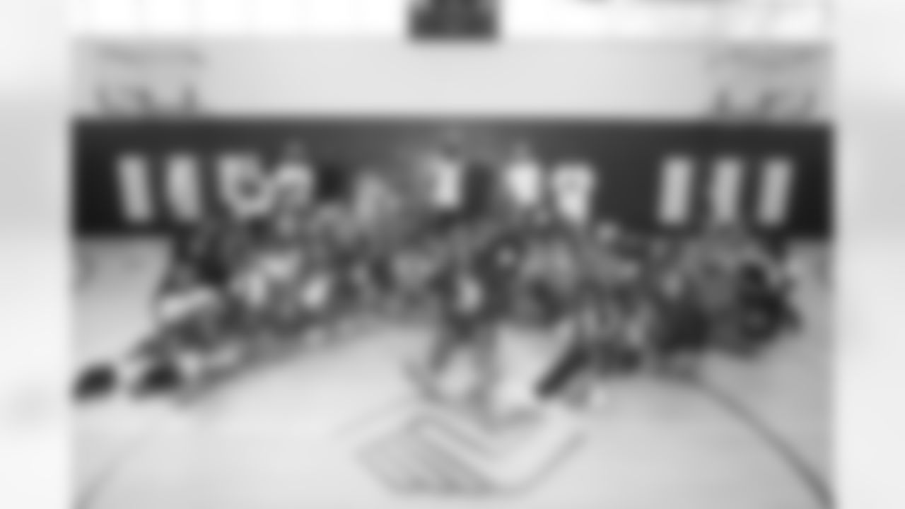 Tremaine Edmunds hands out shoes and school supplies at the Boys and Girls Club of Buffalo, Masten Club House, on August 15, 2022.  Photo by Ben Green