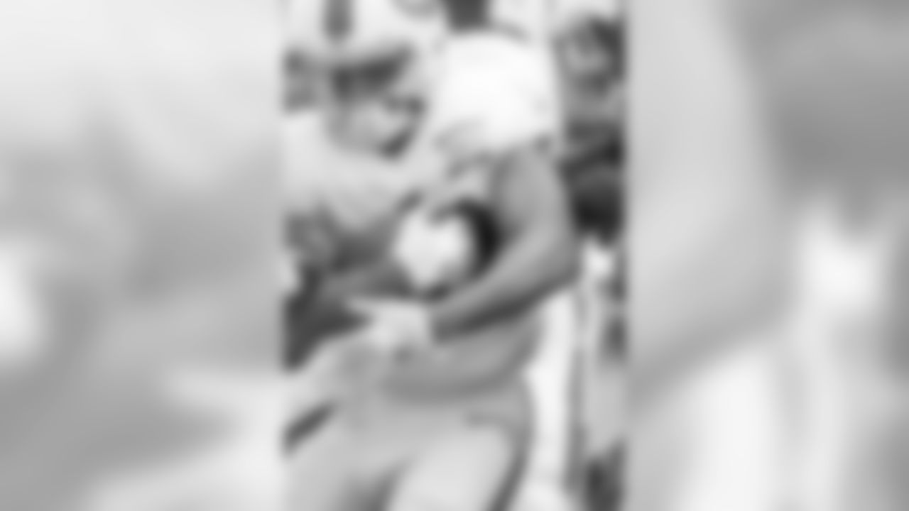 A member of the offense protects the ball.