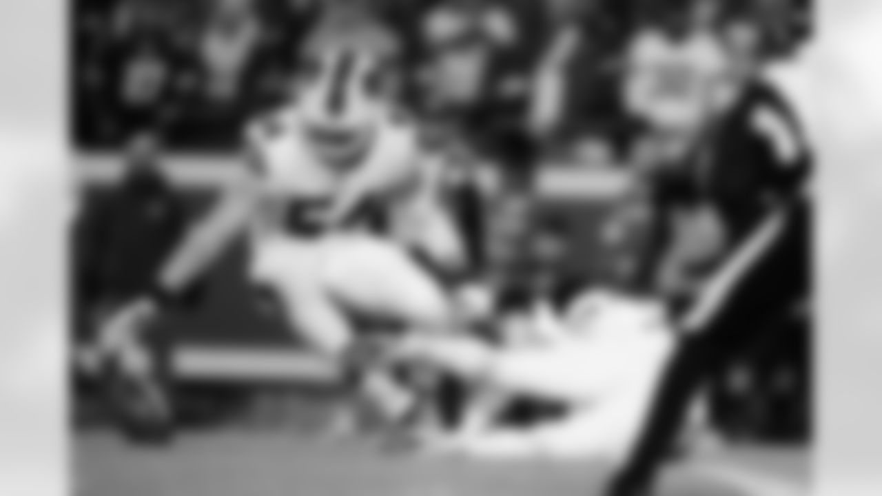 A.J. Klein (54) and Tyler Matakevich (44) stop the ball from rolling into the end zone during a punt. Buffalo Bills vs Kansas City Chiefs - AFC Divisional Playoff game at GEHA Field at Arrowhead Stadium, January 23, 2022. Photo by Ben Green