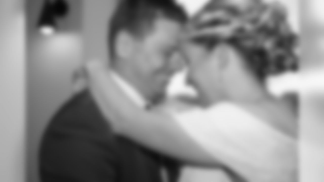 The Buffalo Bills celebrate the marriage of Mackenzie Park and Jordan Binggeli, the winning couple from the “Halftime Wedding Experience of a Lifetime†contest, at New Era Field on September 29, 2019.