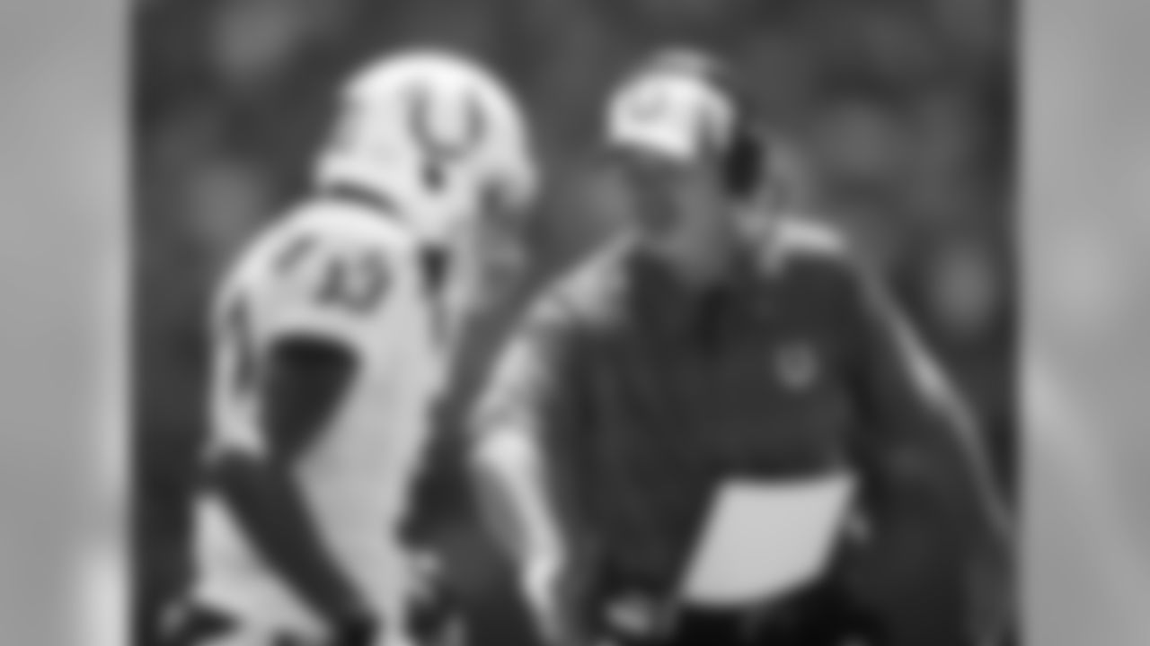 Indianapolis Colts head coach Chuck Pagano, right, congratulates T.Y. Hilton (13) following a touchdown catch during the first half of an NFL preseason football game against the Buffalo Bills, Sunday, Aug. 11, 2013, in Indianapolis. (AP Photo/AJ Mast)