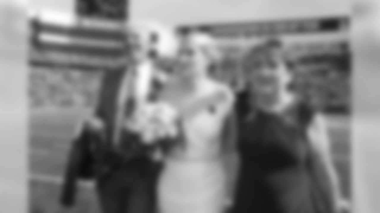 The Buffalo Bills celebrate the marriage of Mackenzie Park and Jordan Binggeli, the winning couple from the ÒHalftime Wedding Experience of a LifetimeÓ contest, at New Era Field on September 29, 2019.