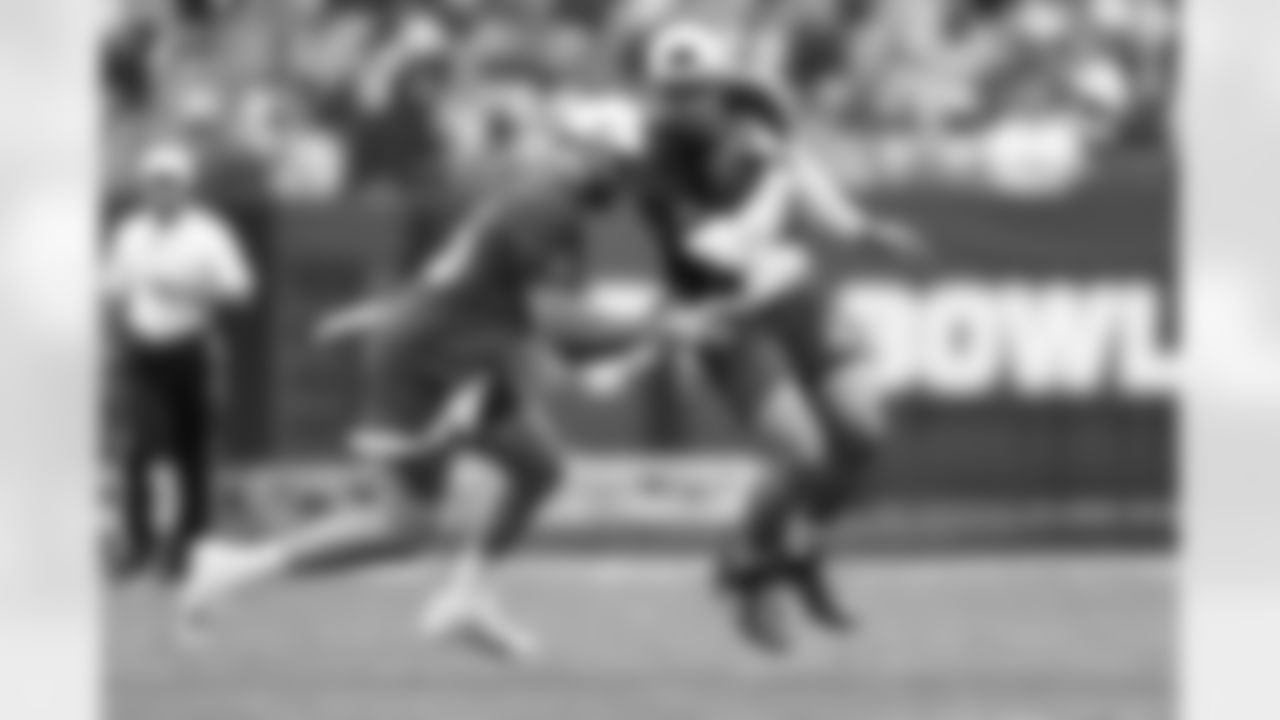 New York Giants running back Saquon Barkley (26) gets his flagged pull by Buffalo Bills linebacker Matt Milano (58) during the 2023 Pro Bowl Games on Sunday, February 5, 2023 in Las Vegas, Nevada. (Mikey Owens/NFL)