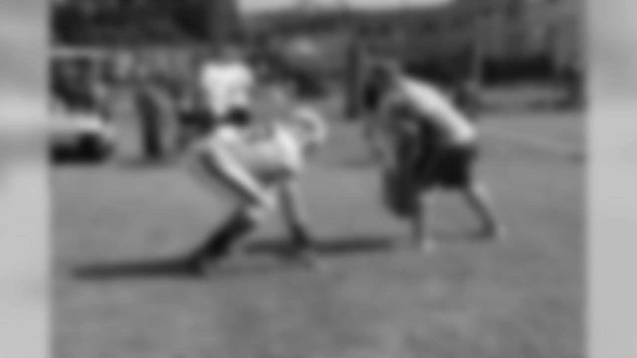 Offensive tackle Jordan Mills (79) runs a drill during practice.
