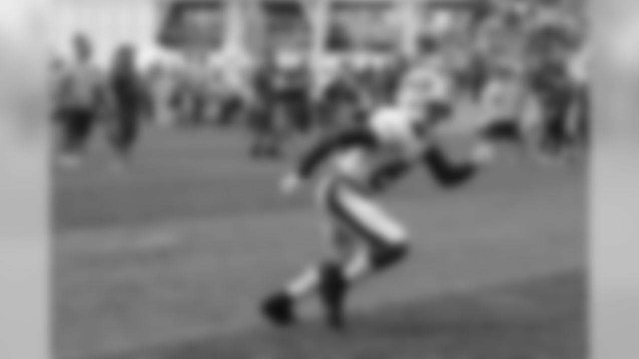 Wide receiver Marquise Goodwin (88) runs a drill on the field.