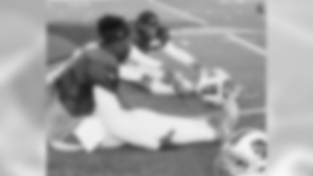 Cornerback Ronald Darby (28) and quarterback Tyrod Taylor (5) stretch before the scrimmage.