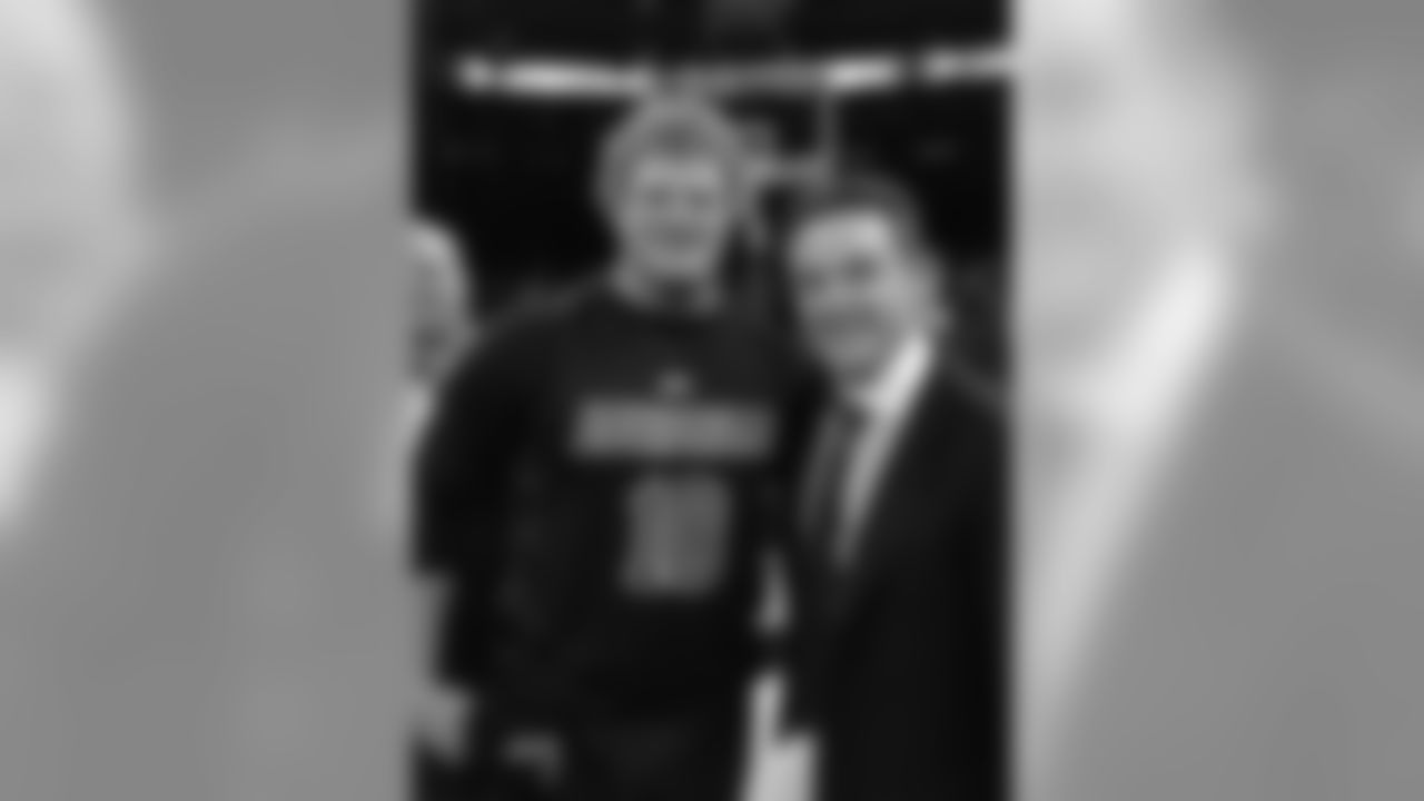 Louisville alum and Bills C Eric Wood and coach Rick Pitino celebrate the Cardinals Big East Tournament title on the court at Madison Square Garden.