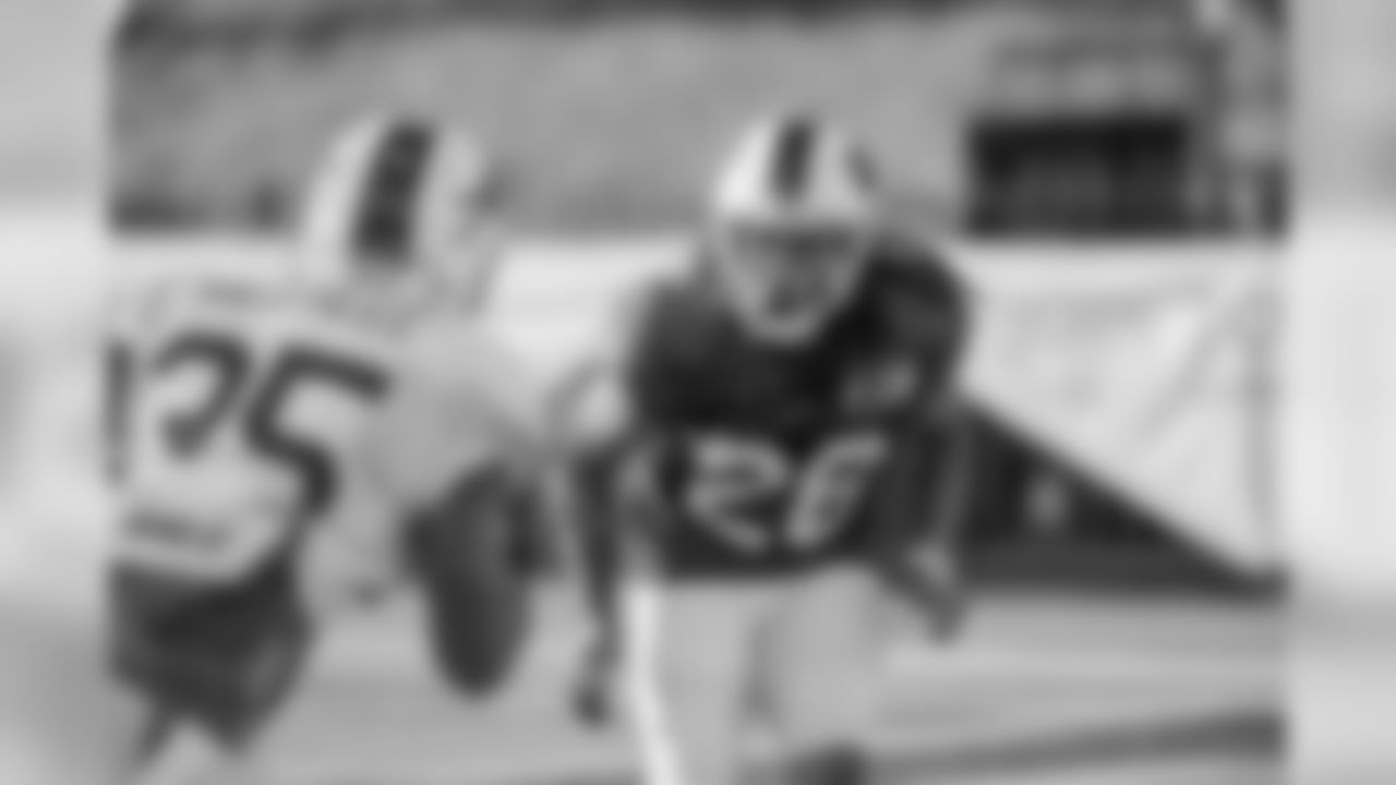 Cornerback Ronald Darby (28) goes in to cover running back Mike Gillislee (35).
