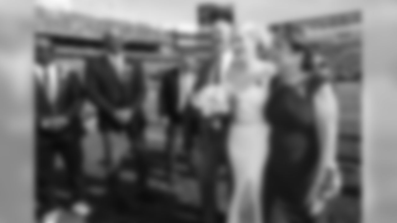 The Buffalo Bills celebrate the marriage of Mackenzie Park and Jordan Binggeli, the winning couple from the ÒHalftime Wedding Experience of a LifetimeÓ contest, at New Era Field on September 29, 2019.