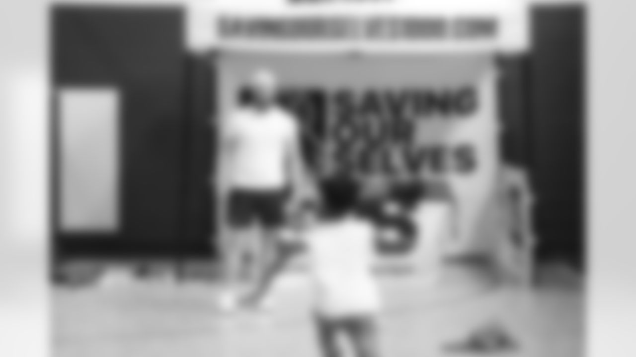 Tremaine Edmunds hands out shoes and school supplies at the Boys and Girls Club of Buffalo, Masten Club House, on August 15, 2022. Photo by Ben Green