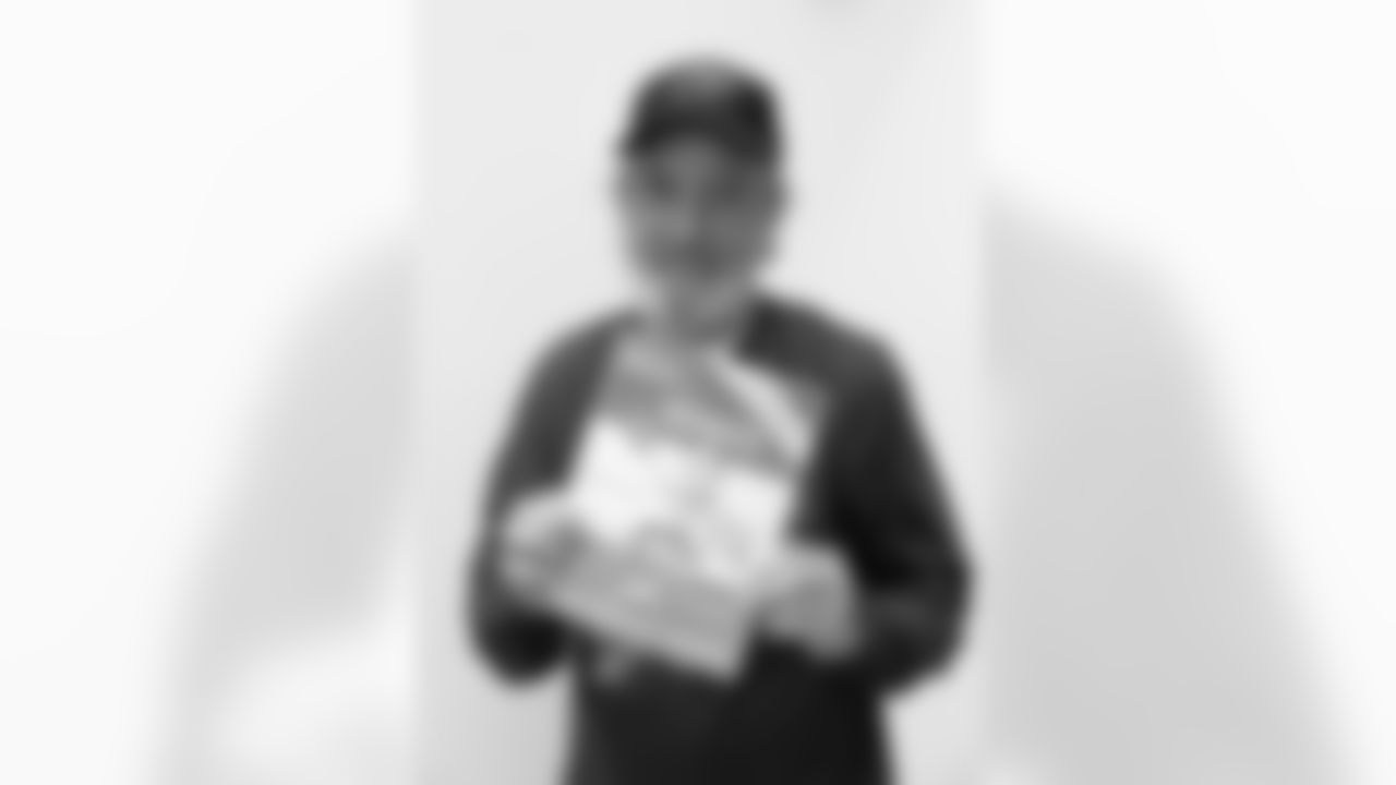 Buffalo Bills fan Tom Farley with his program from a 1963 playoff game, at One Bills Drive, September 27, 2023