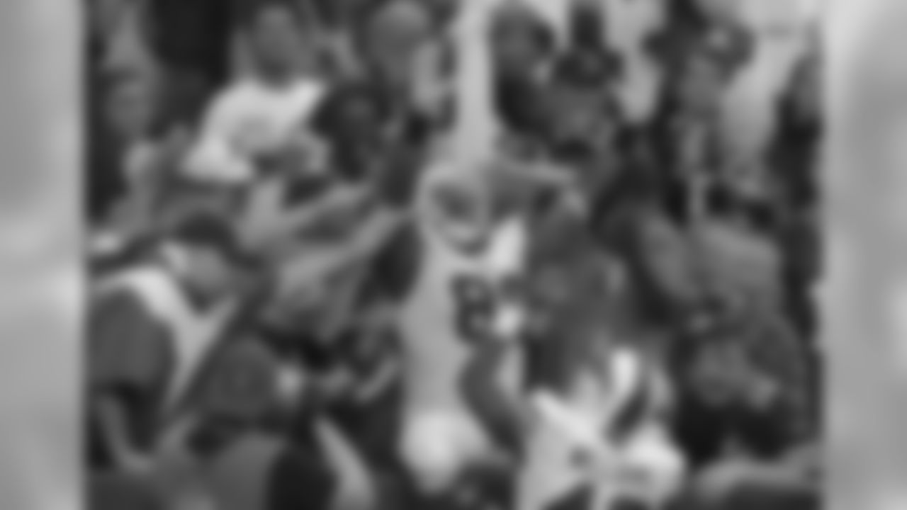 Tight end Chris Gragg (89) leans back into the crowd to celebrate the first touchdown of the season.