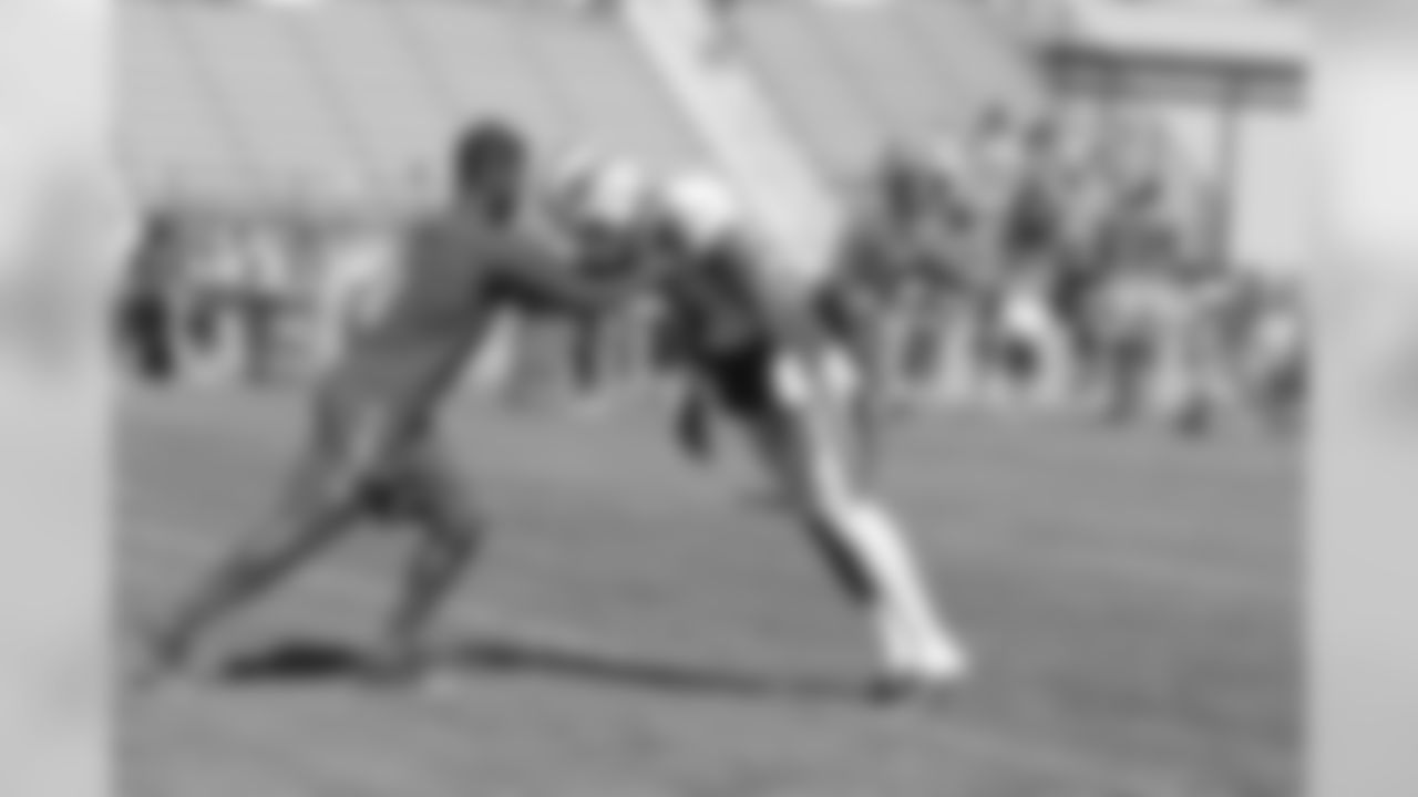 Wide receiver Dezmin Lewis (13) leaning for a drill.