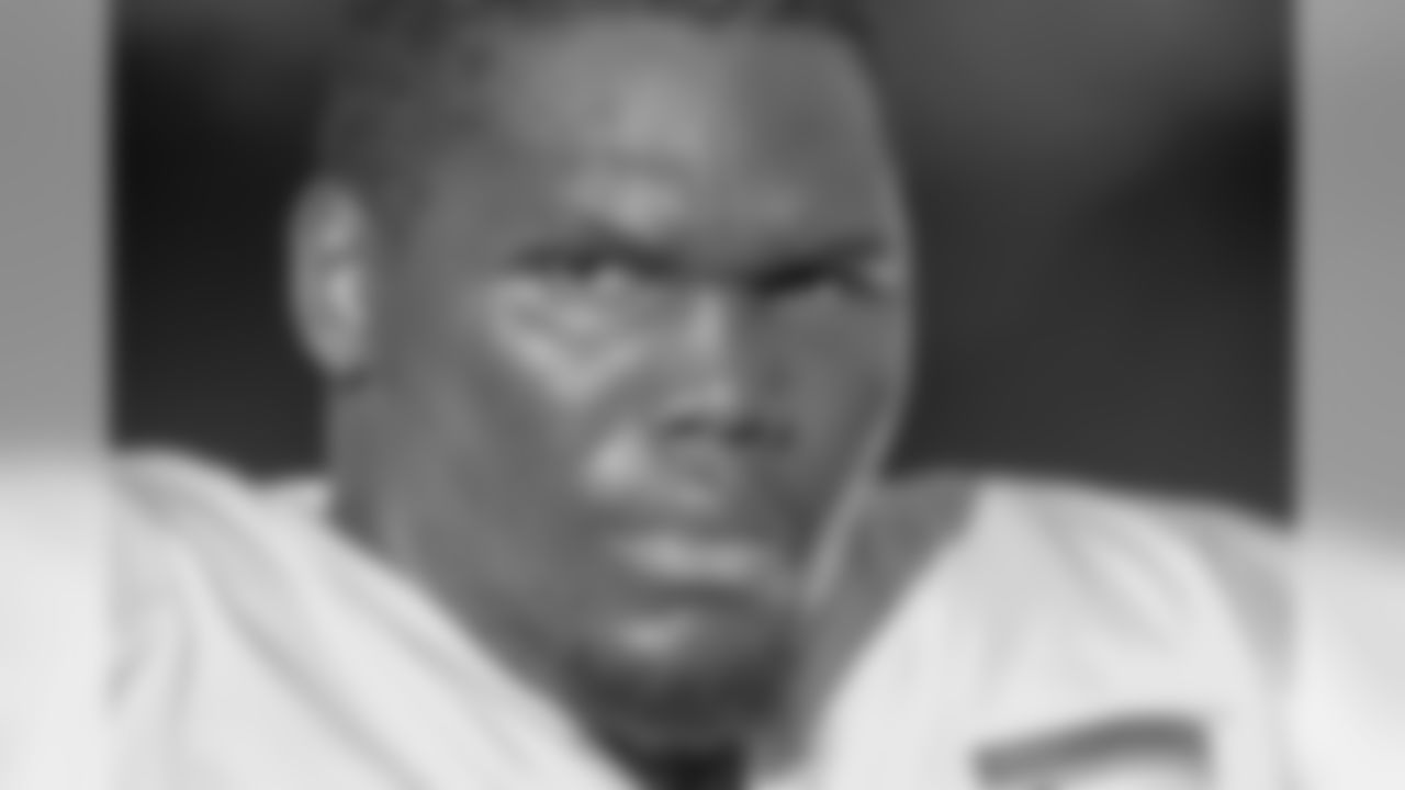 Offensive tackle Jordan Mills (79) looks at the field.